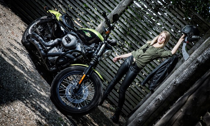 Woman with motorcycle and helmet