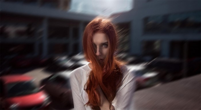 Redhead woman with motion blur in a fashion photoshoot