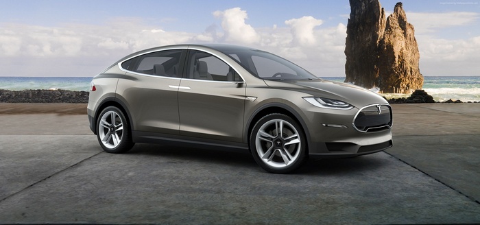 Tesla Model X electric SUV on a rocky coast