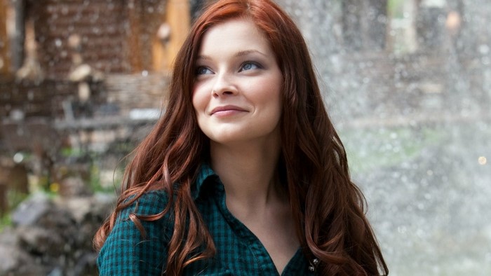 Woman with long red hair and blue eyes