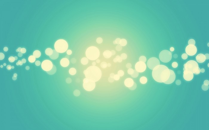 Abstract bokeh lights on a teal background