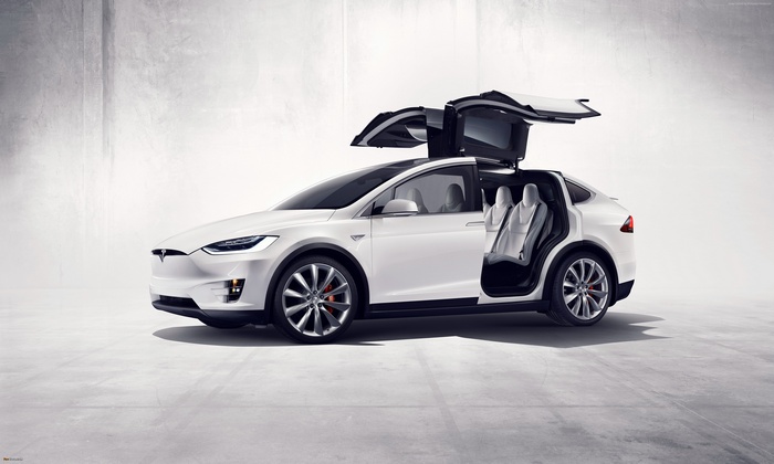 White Tesla Model X SUV with Falcon Wing Doors Open