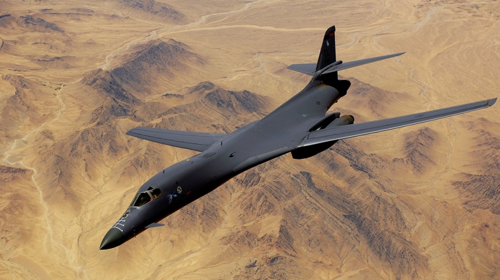 Rockwell B-1 Lancer strategic bomber flying over desert