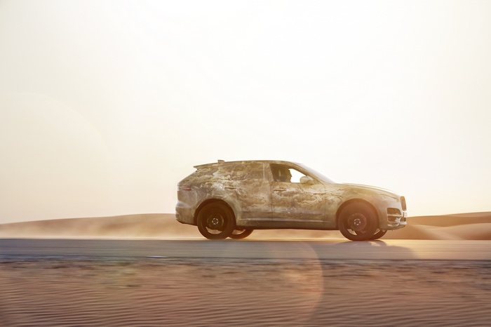 Jaguar F-Pace driving through a desert landscape