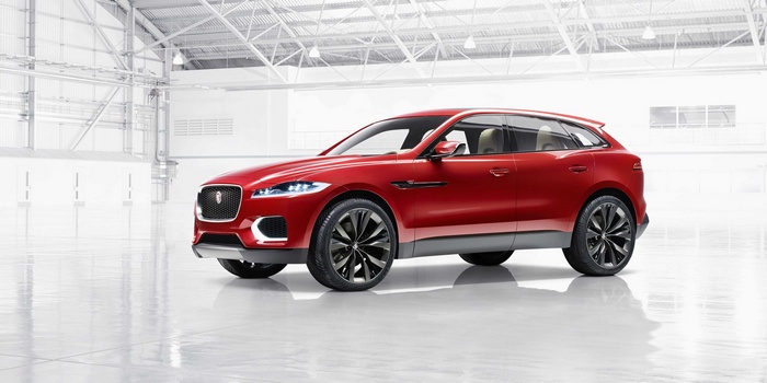 Red Jaguar F-Pace SUV in a warehouse