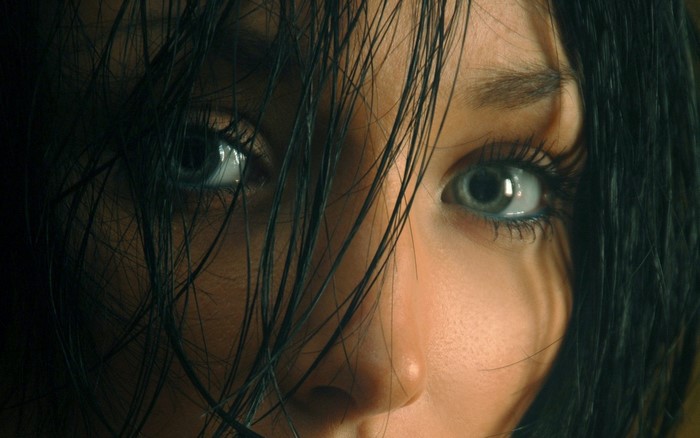 Close up of a woman's face with dark hair
