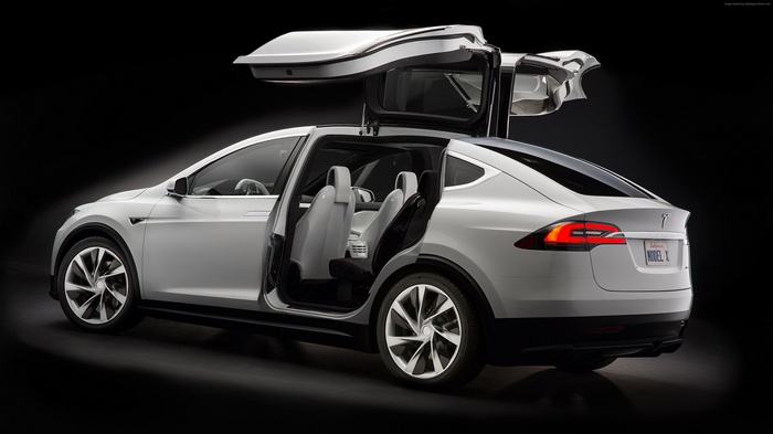 White Tesla Model X SUV with Falcon Wing Doors Open