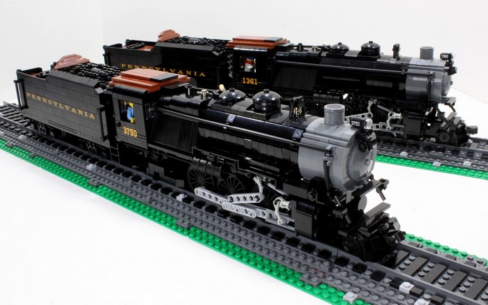 Two LEGO steam locomotives on tracks