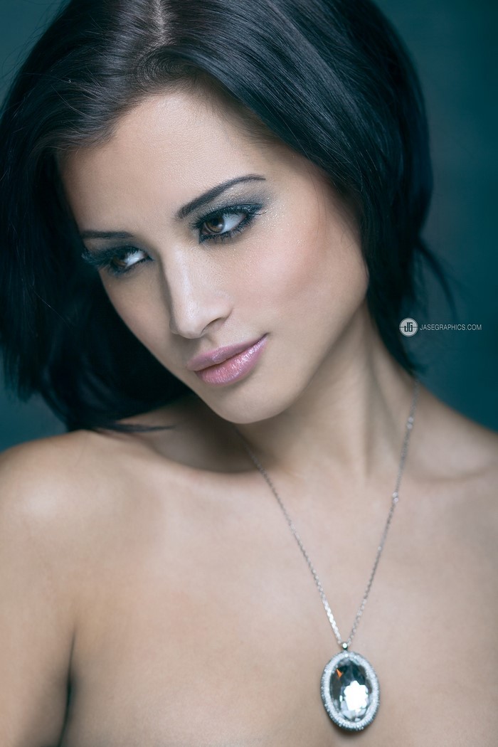 Woman with black hair and necklace