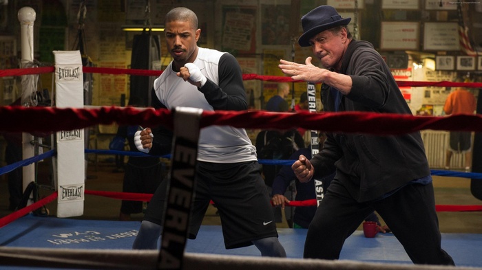 Michael B. Jordan and Sylvester Stallone in Creed boxing ring
