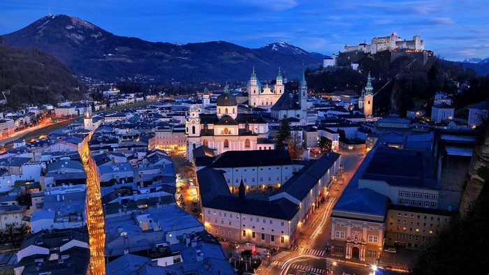 Salzburg cityscape with Hohensalzburg Fortress at dusk