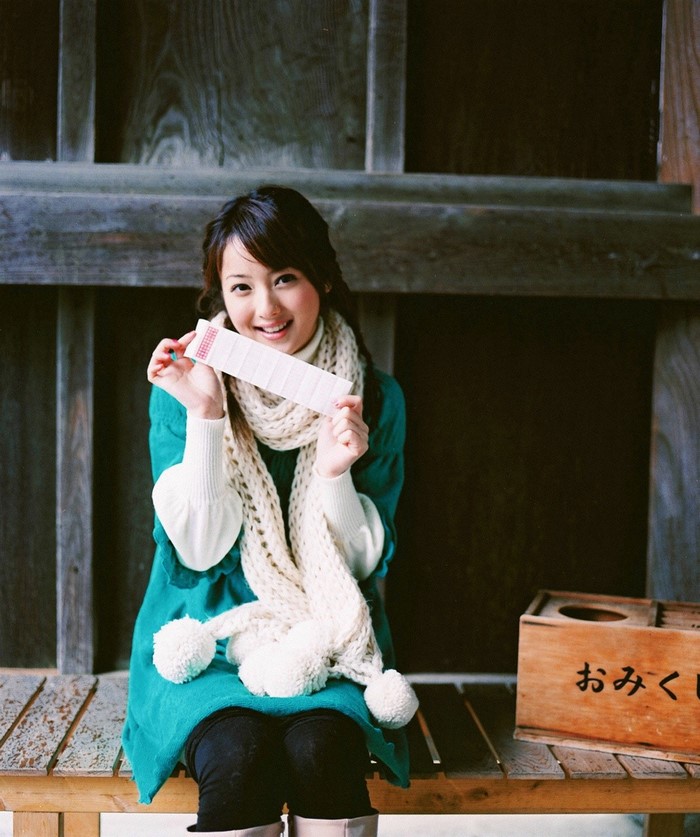 Sasaki Nozomi wearing a teal dress and scarf