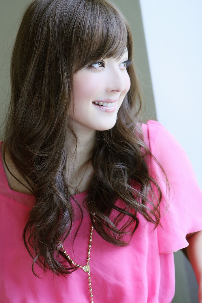 Sasaki Nozomi portrait with pink top and necklace