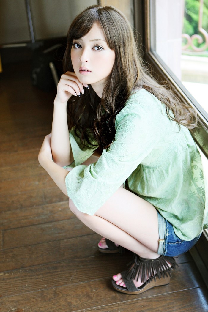 Portrait of a Woman Squatting by the Window