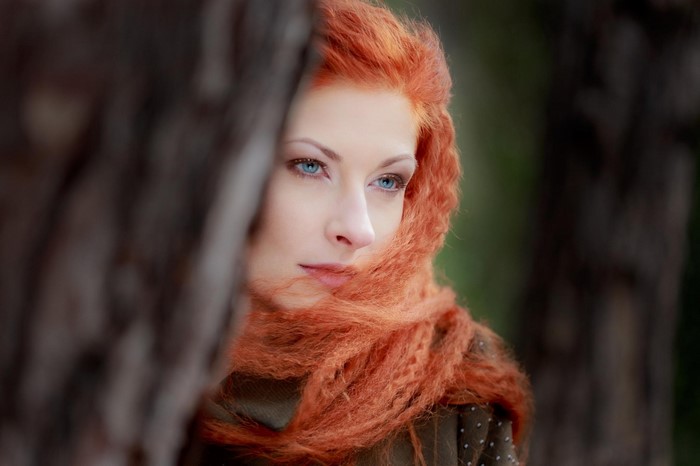 Portrait of a Thoughtful Redhead Woman Outdoors