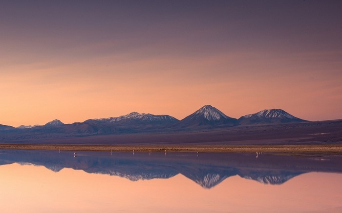 Mountains reflecting in a lake at sunset
