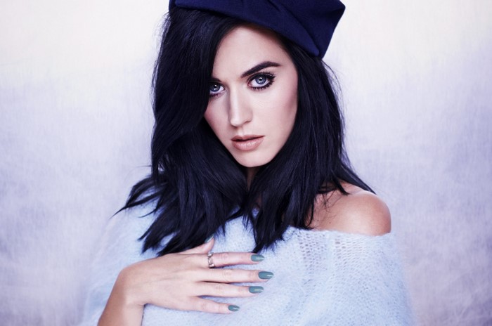 Katy Perry wearing a blue hat and sweater