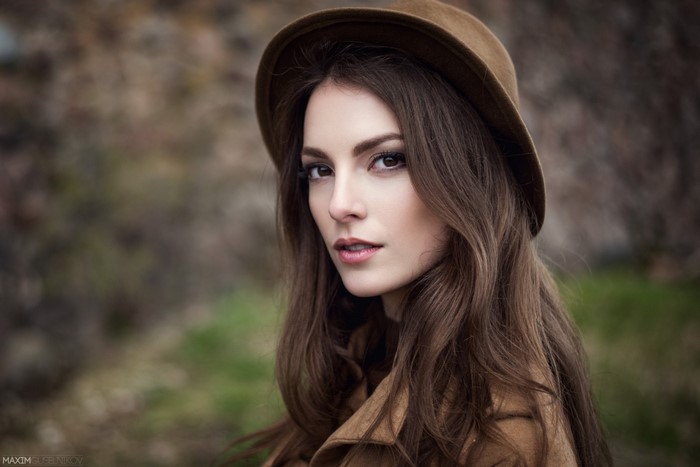 Woman wearing a brown hat and coat, portrait photography