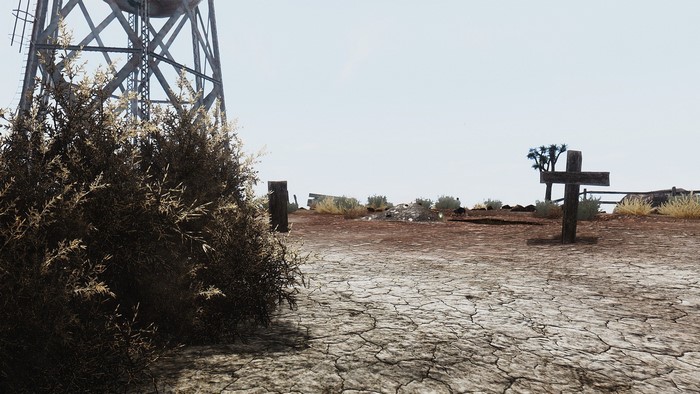 Fallout New Vegas desert landscape with water tower and graves
