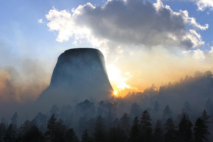 Devils Tower National Monument at sunrise with smoke