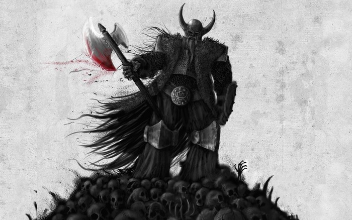 Viking warrior with bloody axe standing on skulls