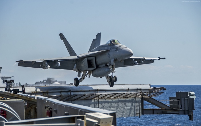 F/A-18E Super Hornet landing on aircraft carrier