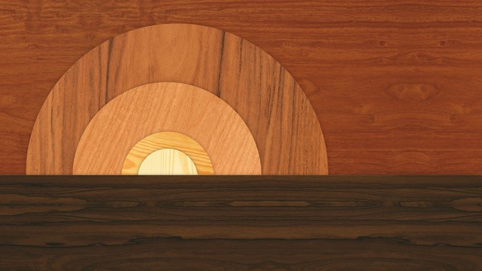 Wooden semicircles against a wood-paneled wall