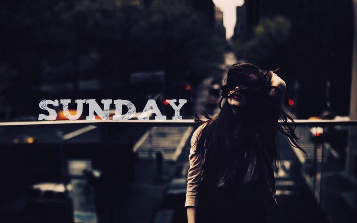 Sunday text with a woman in the background
