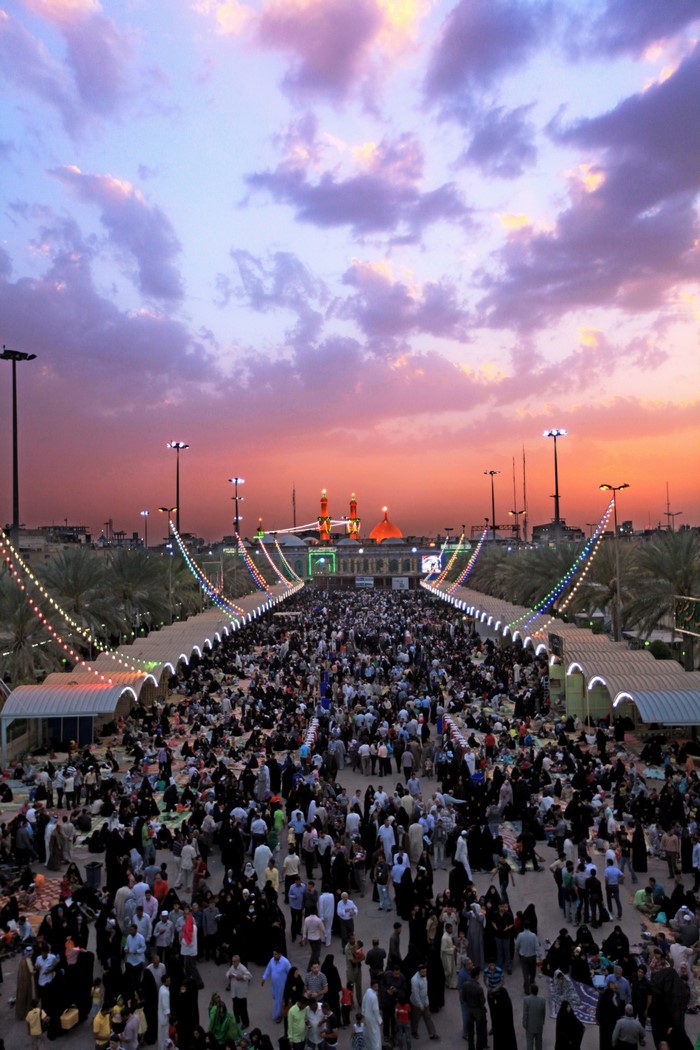 Crowd gathered at Imam Hussain shrine during sunset
