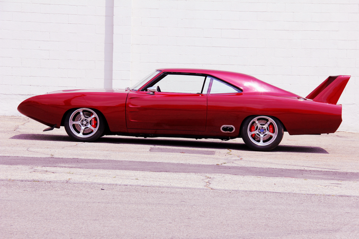Red Dodge Daytona muscle car with wing