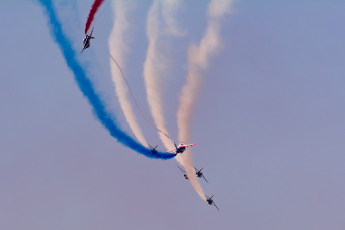 Patrouille de France jets performing aerobatics with colored smoke