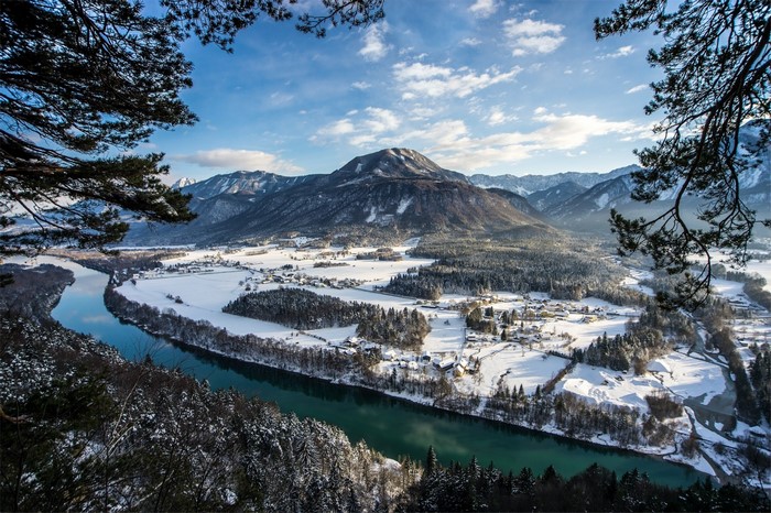 Snowy valley with river and mountains