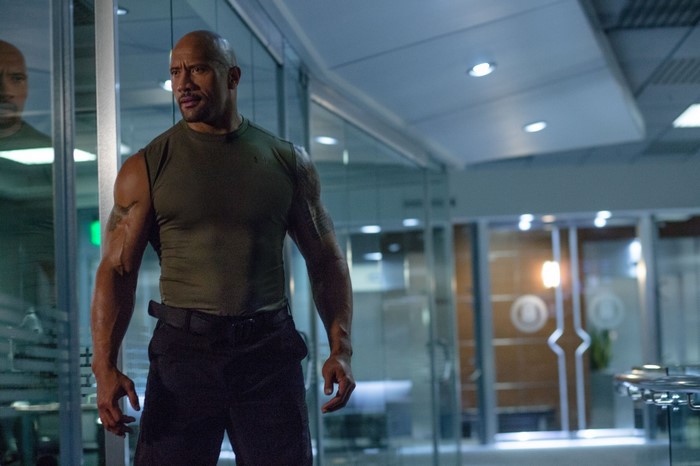 Dwayne Johnson in a green tank top