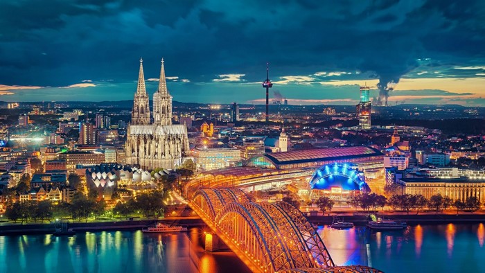 Cologne cityscape at night with Cologne Cathedral and Hohenzollern Bridge