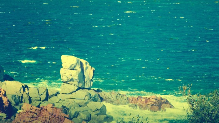 Rocky coast with turquoise sea and waves