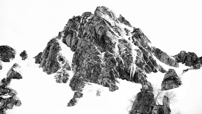 Monochrome mountain landscape with snow and rocks