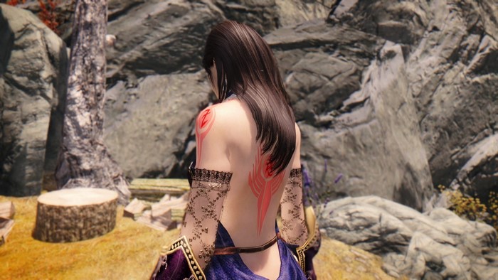 Woman with tattoos in a fantasy setting