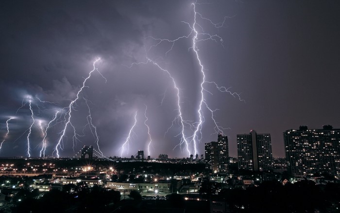 City skyline during a lightning storm at night