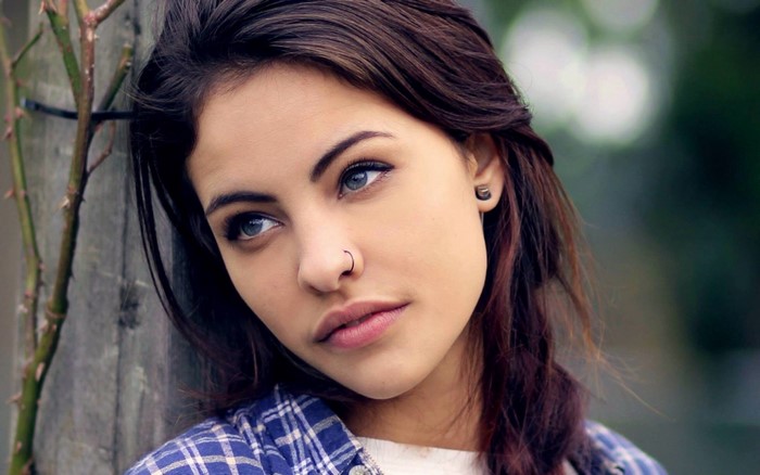 Close-up Portrait of Woman with Nose Ring and Blue Eyes
