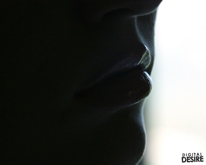 Close up of lips and nose in shadow