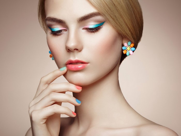 Elegant Woman with Colorful Makeup and Accessories