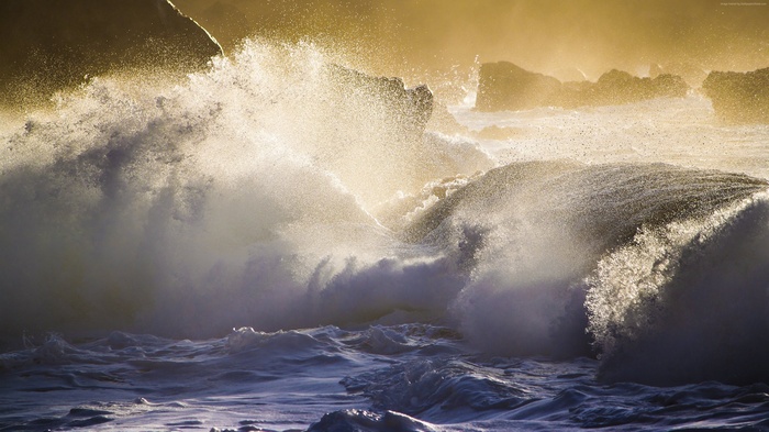 Waves crashing on rocks in the Pacific Ocean