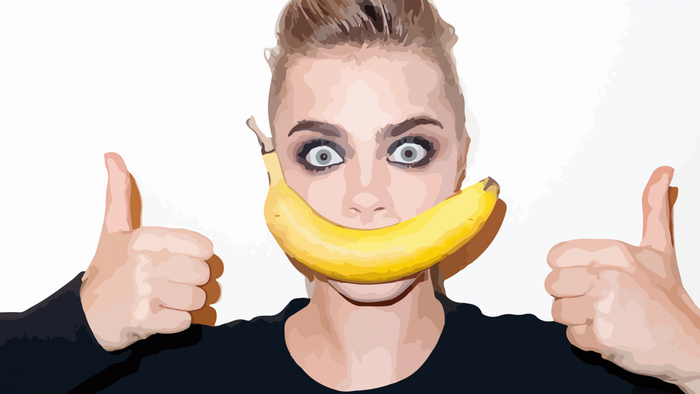 Woman with banana over mouth and thumbs up