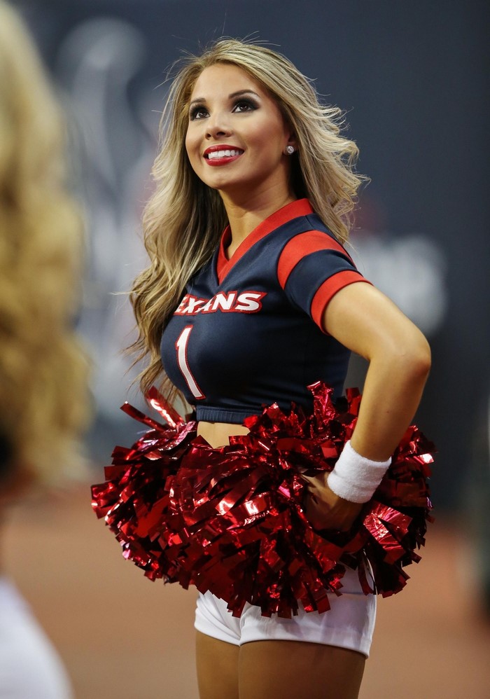 Houston Texans cheerleader with red pom-poms
