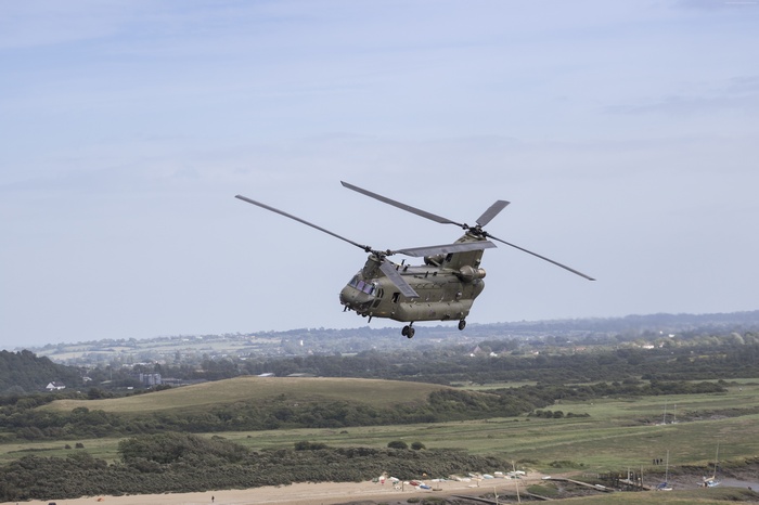 Boeing Chinook helicopter flying over landscape