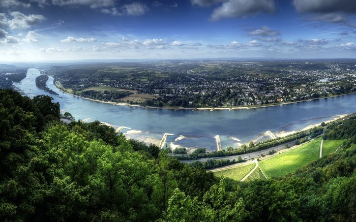 River bend with city and vineyards from a hilltop