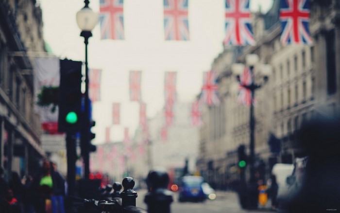 Street decorated with Union Jack flags and traffic lights