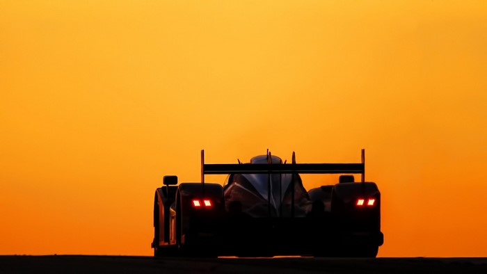 Peugeot 908 race car at sunset