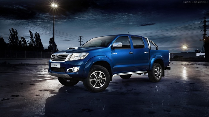 Blue Toyota Hilux Invincible pickup truck at night