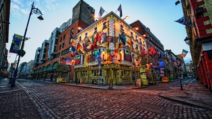 Temple Bar, Dublin, Ireland, with flags and streetlights